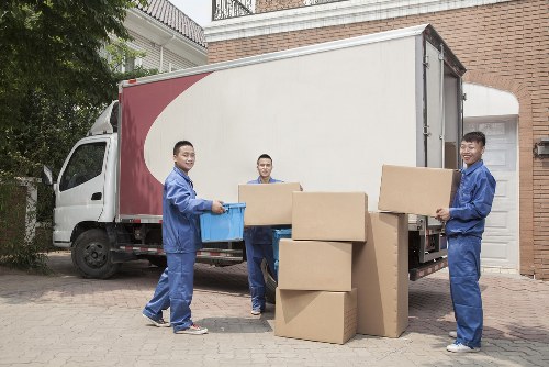Man and van team handling belongings safely with protective equipment
