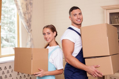 Careful packing of household items for a South London flat move